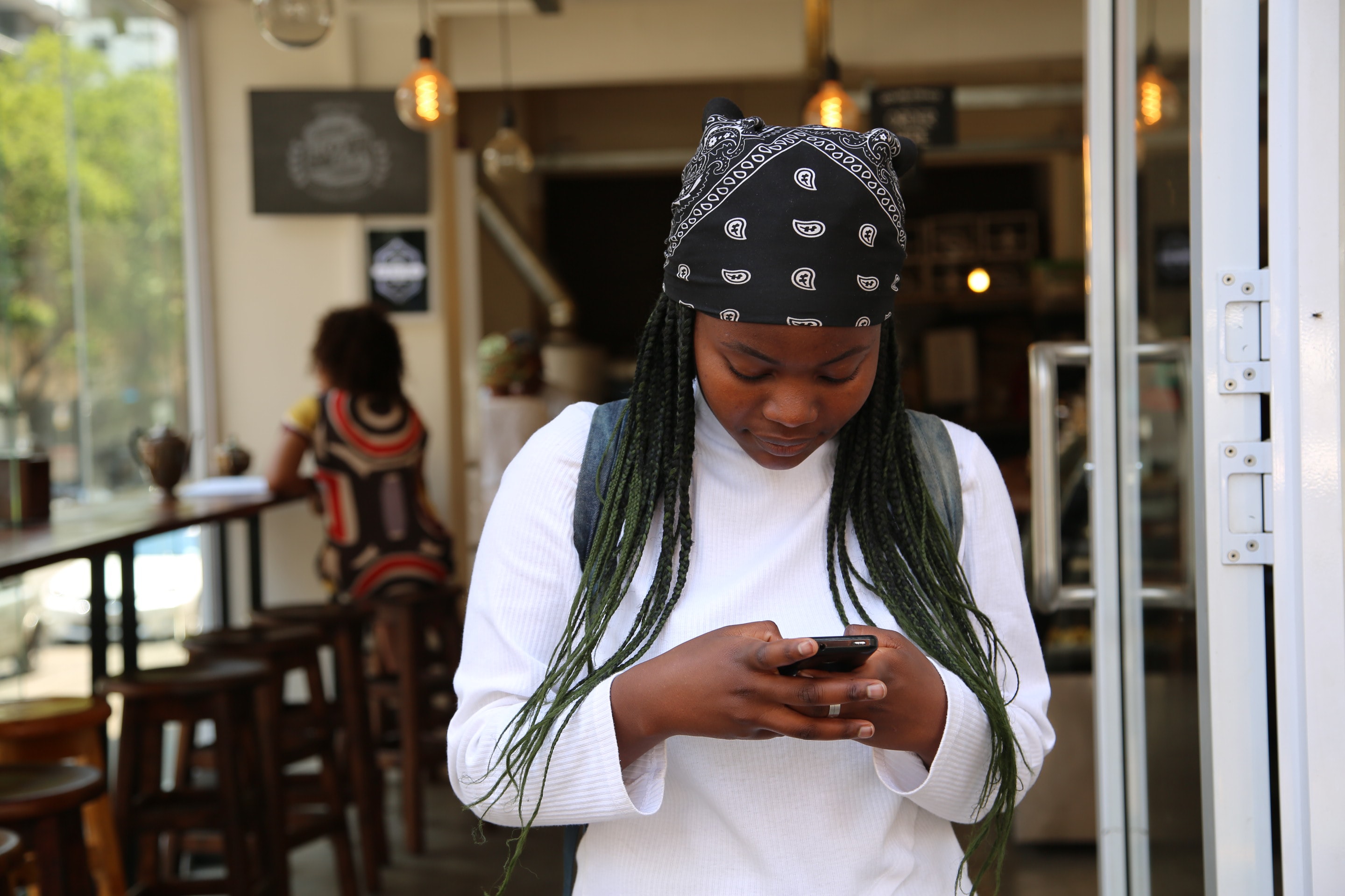 Girl using her cellphone talking to a chatbot